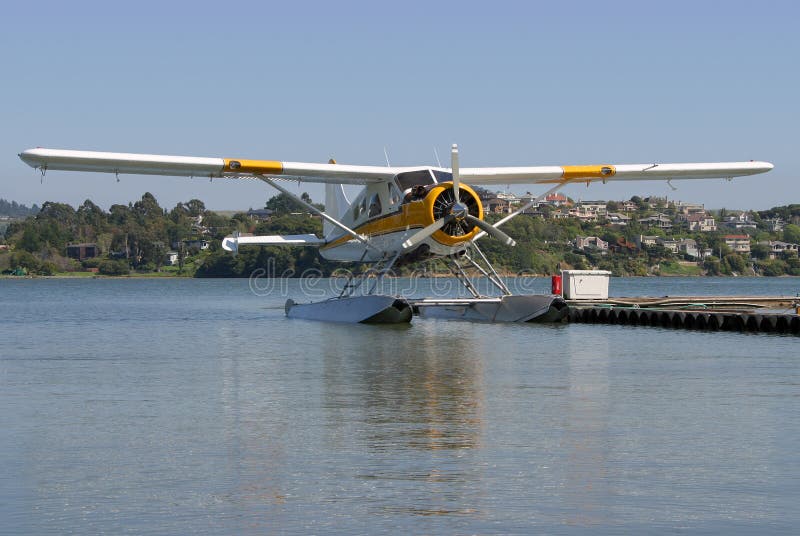 A seaplane floats on standby. A seaplane floats on standby.