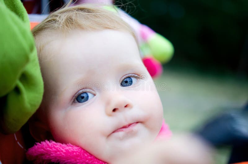 1 year old girl in baby carriage royalty free stock photo