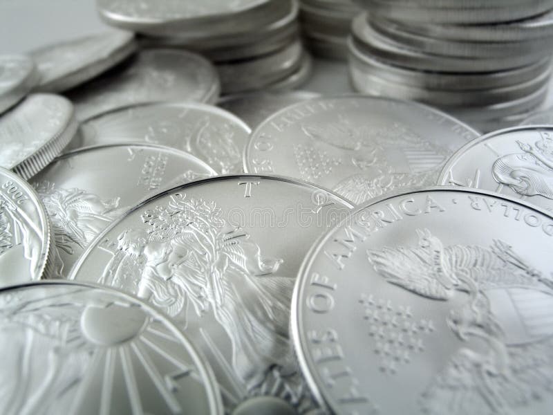 Close-up macro (depth-of-field) shot of $1 Silver U.S. Bullion Coins. Shot on Canon. Close-up macro (depth-of-field) shot of $1 Silver U.S. Bullion Coins. Shot on Canon.