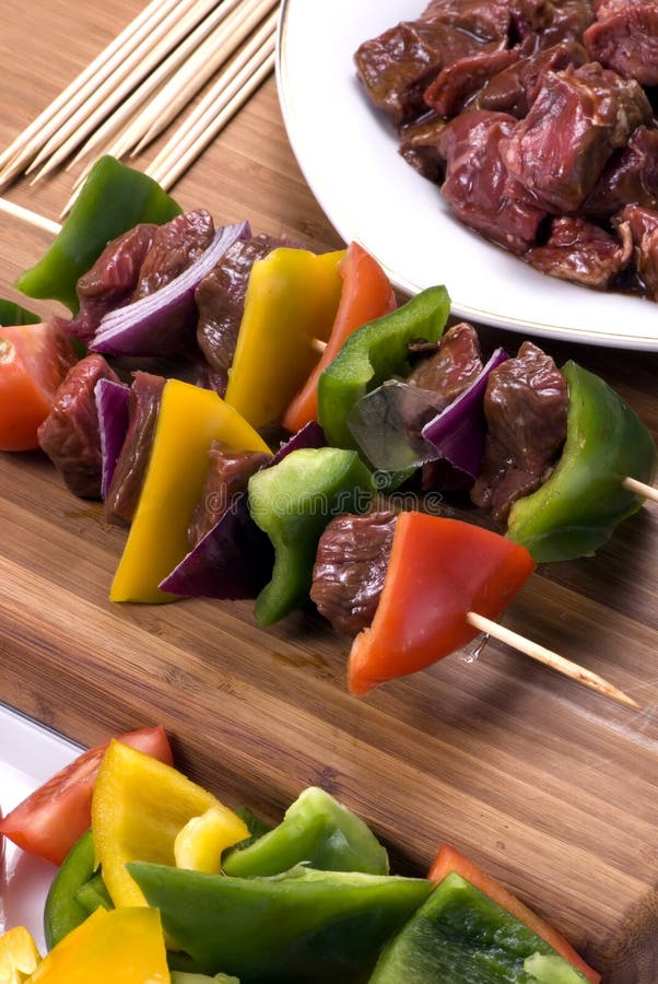 Preparing fresh beef steak shishkabobs with vegatables. Preparing fresh beef steak shishkabobs with vegatables