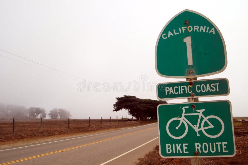 A signpost of the Highway No.1 in California, USA on a foggy landscape. A signpost of the Highway No.1 in California, USA on a foggy landscape.