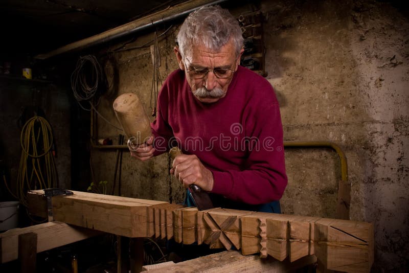 Old woodcarver work in the workshop 1. Old woodcarver work in the workshop 1