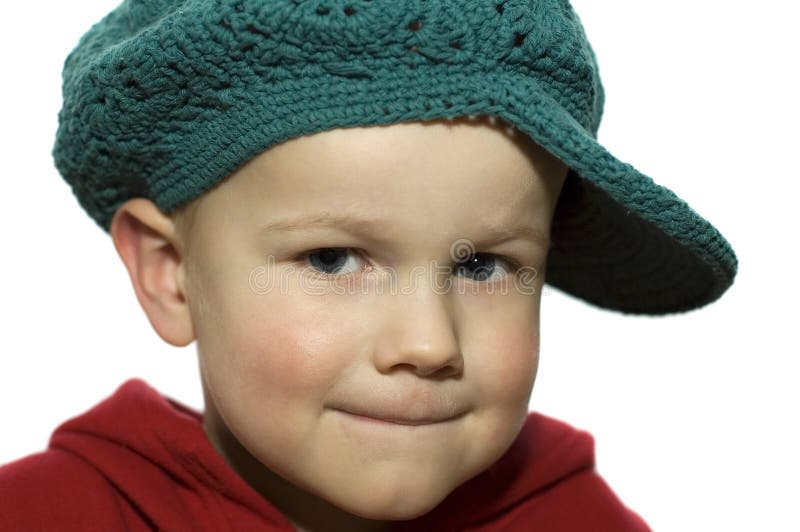 Cute picture of a little 3 year old wearing a green hat. Cute picture of a little 3 year old wearing a green hat.