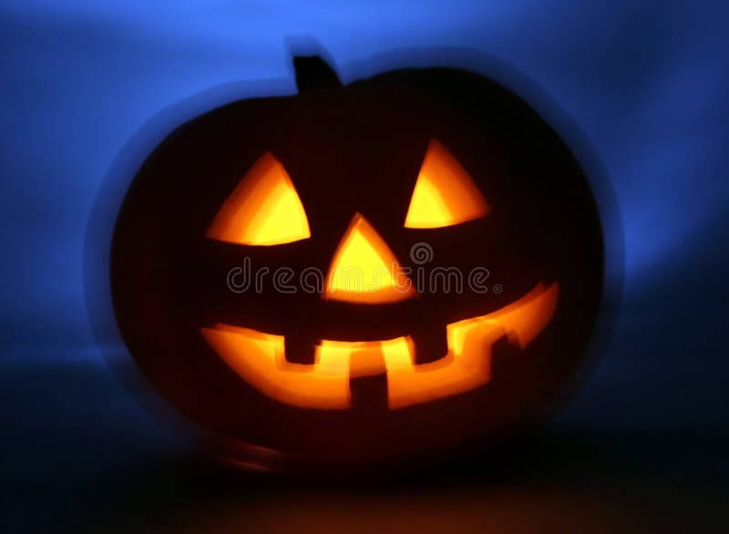 Halloween pumpkin blur zoom. Scary smiling and cold back light. Halloween pumpkin blur zoom. Scary smiling and cold back light.