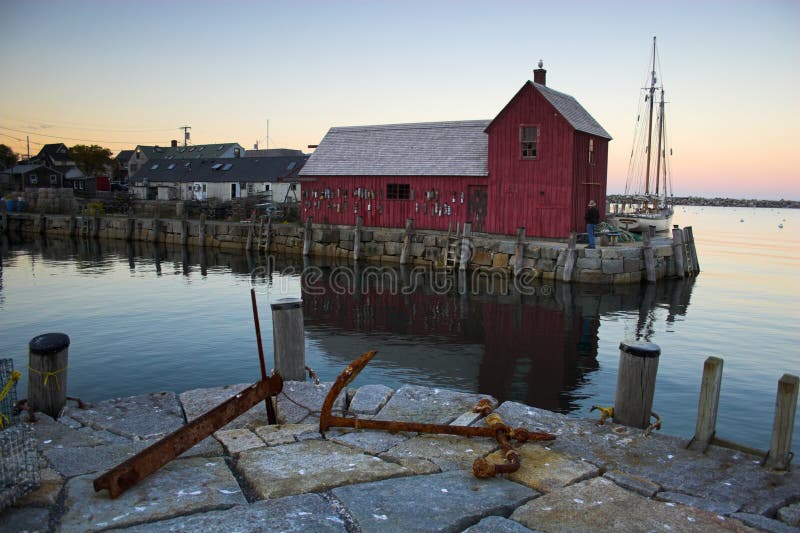 Most photographed famous fishing shack in Bearskin Neck Wharf in New England on the background with antique anchors on the foreground. Most photographed famous fishing shack in Bearskin Neck Wharf in New England on the background with antique anchors on the foreground.