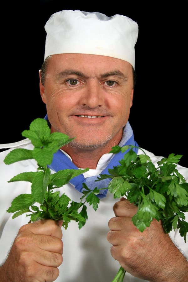 Chef with his fresh herbs ready to prepare. Chef with his fresh herbs ready to prepare.