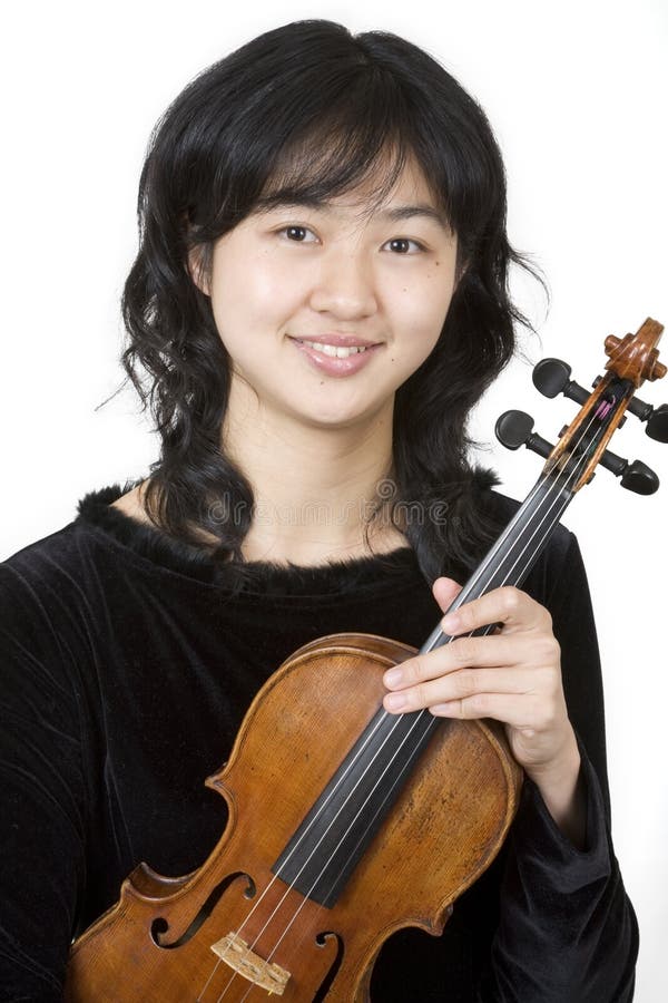 Asian violinist 1, holding her violin. Asian violinist 1, holding her violin