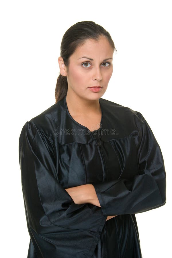 Beautiful Hispanic woman judge in black judicial robes standing with her arms crossed. Beautiful Hispanic woman judge in black judicial robes standing with her arms crossed.