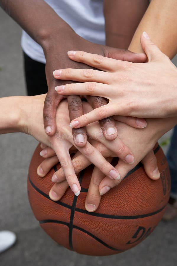 Hands on a basketball. Hands on a basketball