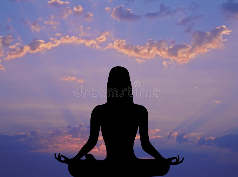 Front silhouette of woman meditating under pink and purple sunrise. Front silhouette of woman meditating under pink and purple sunrise