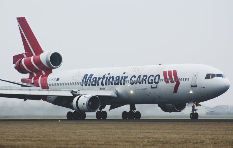 A martinair MD-11 airplane is landing at schiphol airport. A martinair MD-11 airplane is landing at schiphol airport.