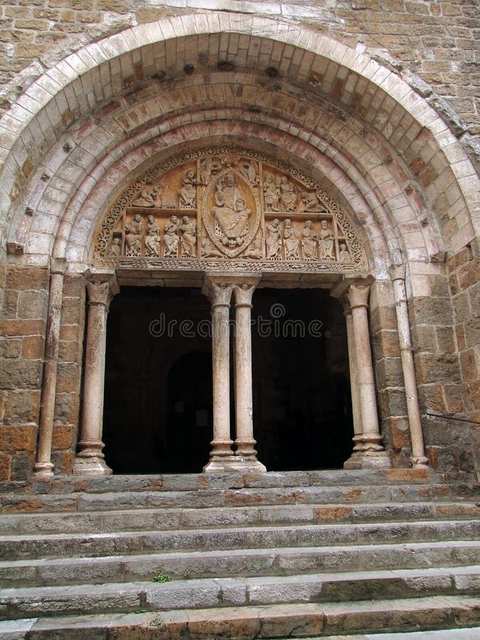 12th century tympanum sculpture over the porch of St. Peter's church, Carennac, France. Medieval tympanum stock images, royalty-free photos and pictures