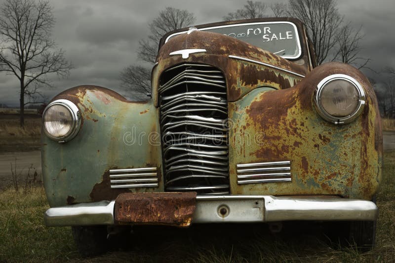 1930's Antique car. That's rusting in a field hoping to be sold 1930's Antique car. That's rusting in a field hoping to be sold