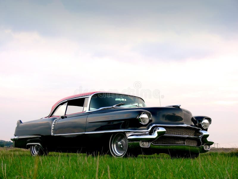 A black and red classic american car from the 1950s. A black and red classic american car from the 1950s