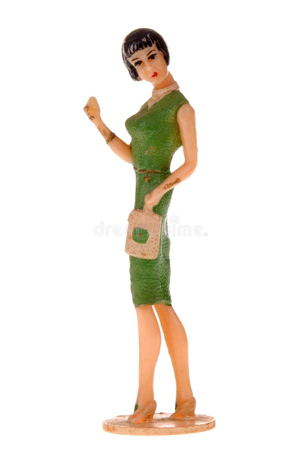 1950's vintage Plastic shopping toy female figure, out for a day of shopping. Isolated on white. 1950's vintage Plastic shopping toy female figure, out for a day of shopping. Isolated on white