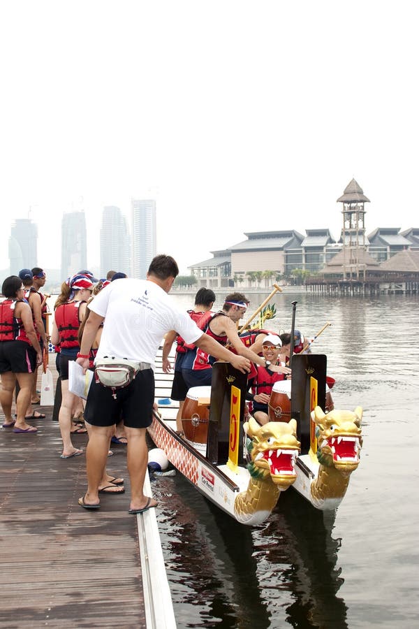 PUTRAJAYA, MALAYSIA - JUNE 19 : International participant preparing their boats during the 1Malaysia International Dragon Boat Festival 2010 (1MIDBF) JUNE 19, 2010 in Putrajaya Malaysia. PUTRAJAYA, MALAYSIA - JUNE 19 : International participant preparing their boats during the 1Malaysia International Dragon Boat Festival 2010 (1MIDBF) JUNE 19, 2010 in Putrajaya Malaysia.