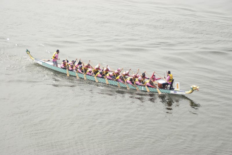 PUTRAJAYA, MALAYSIA - JUNE 19 : Participant rowing their boats during the 1Malaysia International Dragon Boat Festival 2010 (1MIDBF) JUNE 19, 2010 in Putrajaya Malaysia. PUTRAJAYA, MALAYSIA - JUNE 19 : Participant rowing their boats during the 1Malaysia International Dragon Boat Festival 2010 (1MIDBF) JUNE 19, 2010 in Putrajaya Malaysia.