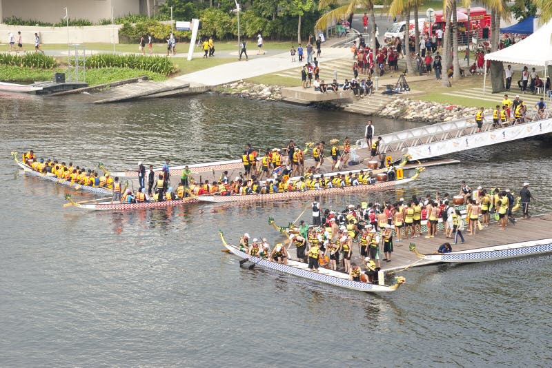 PUTRAJAYA, MALAYSIA - JUNE 19 : Teams preparing for the race during the 1Malaysia International Dragon Boat Festival 2010 (1MIDBF) JUNE 19, 2010 in Putrajaya Malaysia. PUTRAJAYA, MALAYSIA - JUNE 19 : Teams preparing for the race during the 1Malaysia International Dragon Boat Festival 2010 (1MIDBF) JUNE 19, 2010 in Putrajaya Malaysia.