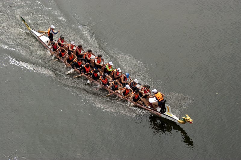 PUTRAJAYA, MALAYSIA - JUNE 19 : International participant is seen rowing in their boats during the 1Malaysia International Dragon Boat Festival 2010 (1MIDBF) JUNE 19, 2010 in Putrajaya Malaysia. PUTRAJAYA, MALAYSIA - JUNE 19 : International participant is seen rowing in their boats during the 1Malaysia International Dragon Boat Festival 2010 (1MIDBF) JUNE 19, 2010 in Putrajaya Malaysia.