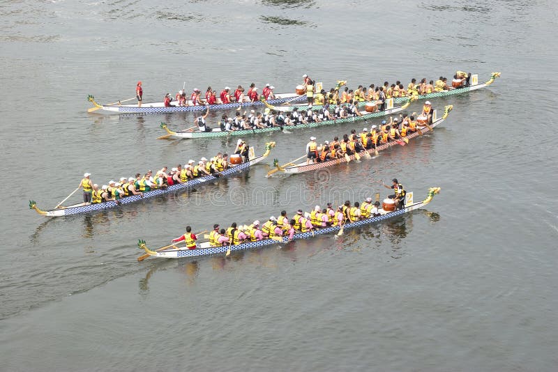 PUTRAJAYA, MALAYSIA - JUNE 19 : Dragon Boats after one of the races during the 1Malaysia International Dragon Boat Festival 2010 (1MIDBF) JUNE 19, 2010 in Putrajaya Malaysia. PUTRAJAYA, MALAYSIA - JUNE 19 : Dragon Boats after one of the races during the 1Malaysia International Dragon Boat Festival 2010 (1MIDBF) JUNE 19, 2010 in Putrajaya Malaysia.