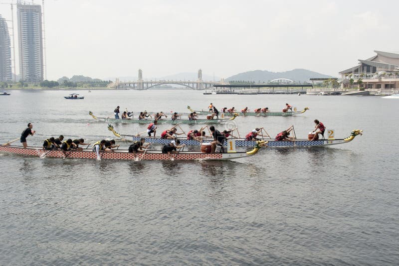 PUTRAJAYA, MALAYSIA - JUNE 19 : International participant is seen rowing in their boats during the 1Malaysia International Dragon Boat Festival 2010 (1MIDBF) JUNE 19, 2010 in Putrajaya Malaysia. PUTRAJAYA, MALAYSIA - JUNE 19 : International participant is seen rowing in their boats during the 1Malaysia International Dragon Boat Festival 2010 (1MIDBF) JUNE 19, 2010 in Putrajaya Malaysia.