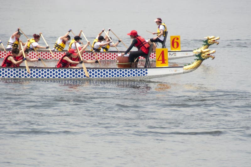 PUTRAJAYA, MALAYSIA - JUNE 19 : International participant is seen rowing in their boats during the 1Malaysia International Dragon Boat Festival 2010 (1MIDBF) JUNE 19, 2010 in Putrajaya Malaysia. PUTRAJAYA, MALAYSIA - JUNE 19 : International participant is seen rowing in their boats during the 1Malaysia International Dragon Boat Festival 2010 (1MIDBF) JUNE 19, 2010 in Putrajaya Malaysia.