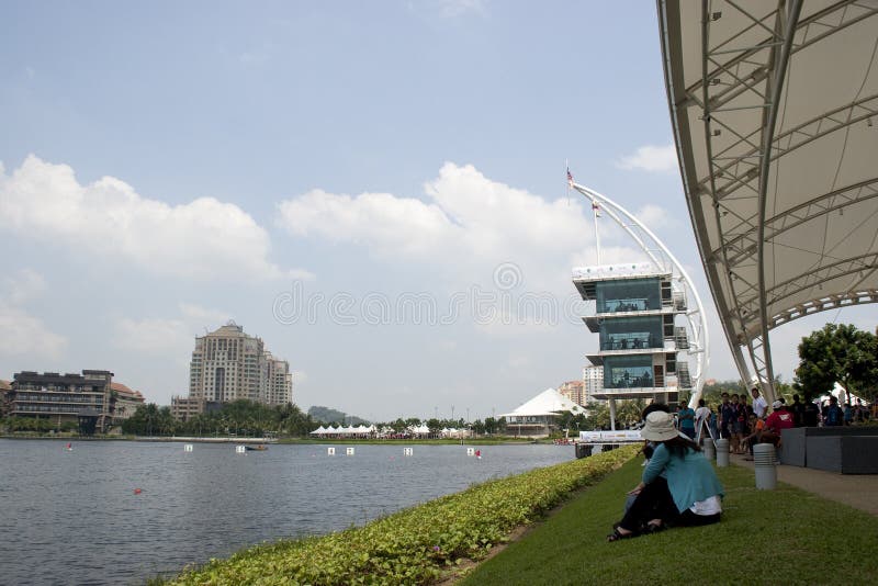 PUTRAJAYA, MALAYSIA - JUNE 19 : Spectator waiting for a race during the 1Malaysia International Dragon Boat Festival 2010 (1MIDBF) JUNE 19, 2010 in Putrajaya Malaysia. PUTRAJAYA, MALAYSIA - JUNE 19 : Spectator waiting for a race during the 1Malaysia International Dragon Boat Festival 2010 (1MIDBF) JUNE 19, 2010 in Putrajaya Malaysia.