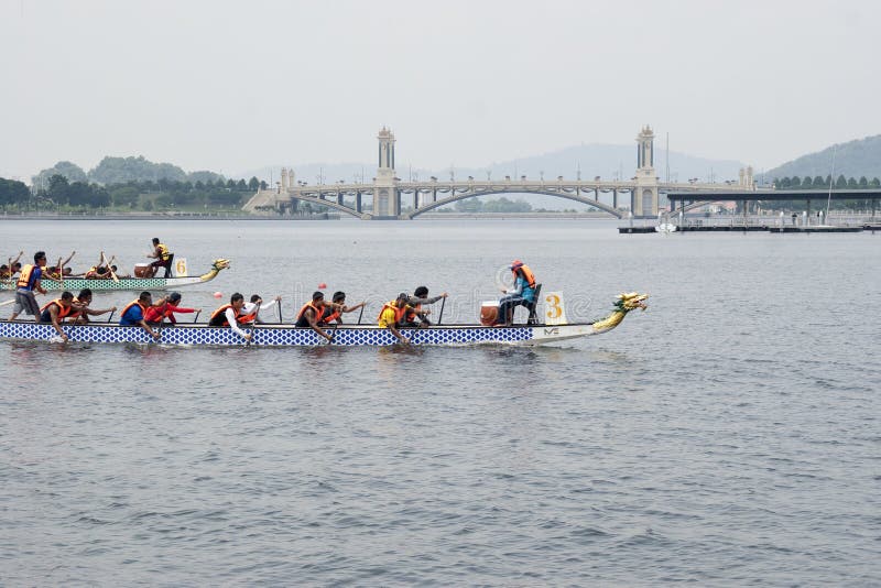 PUTRAJAYA, MALAYSIA - JUNE 19 : International participant is seen rowing in their boats during the 1Malaysia International Dragon Boat Festival 2010 (1MIDBF) JUNE 19, 2010 in Putrajaya Malaysia. PUTRAJAYA, MALAYSIA - JUNE 19 : International participant is seen rowing in their boats during the 1Malaysia International Dragon Boat Festival 2010 (1MIDBF) JUNE 19, 2010 in Putrajaya Malaysia.