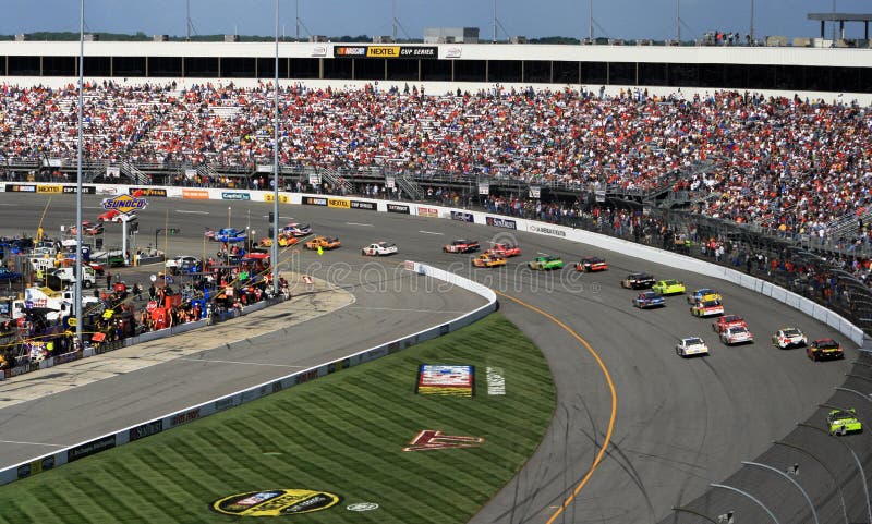 Fans watch the cars barrel through turn 1 at the 2007 spring NASCAR race at Richmond International Raceway. Fans watch the cars barrel through turn 1 at the 2007 spring NASCAR race at Richmond International Raceway.