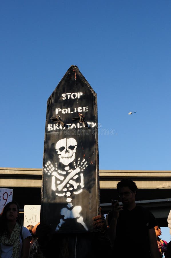 A protester's hand painted sign warning about Police Brutality, held up during the Occupy Oakland March on November 2nd, 2011. A protester's hand painted sign warning about Police Brutality, held up during the Occupy Oakland March on November 2nd, 2011.