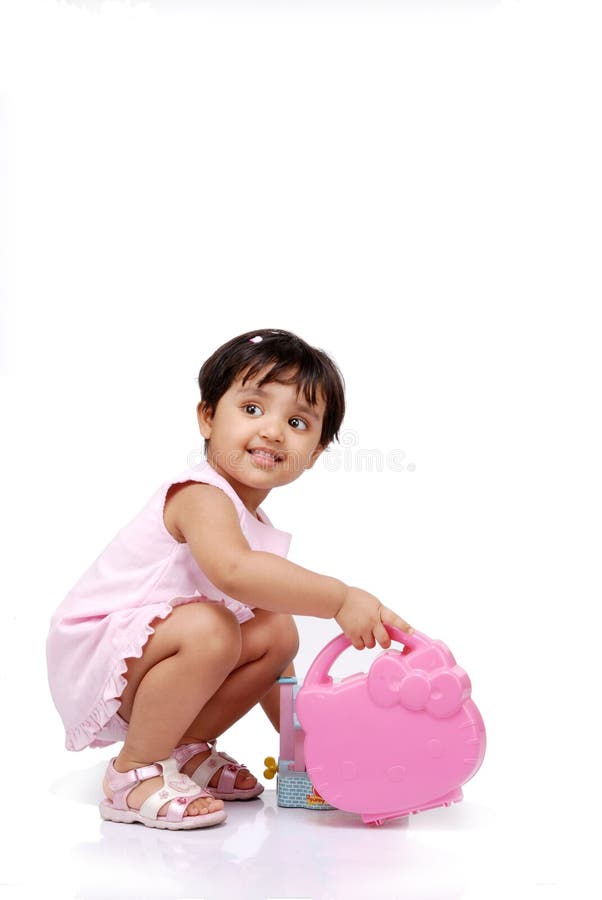 2-3 old year baby girl holding plastic box. 2-3 old year baby girl holding plastic box