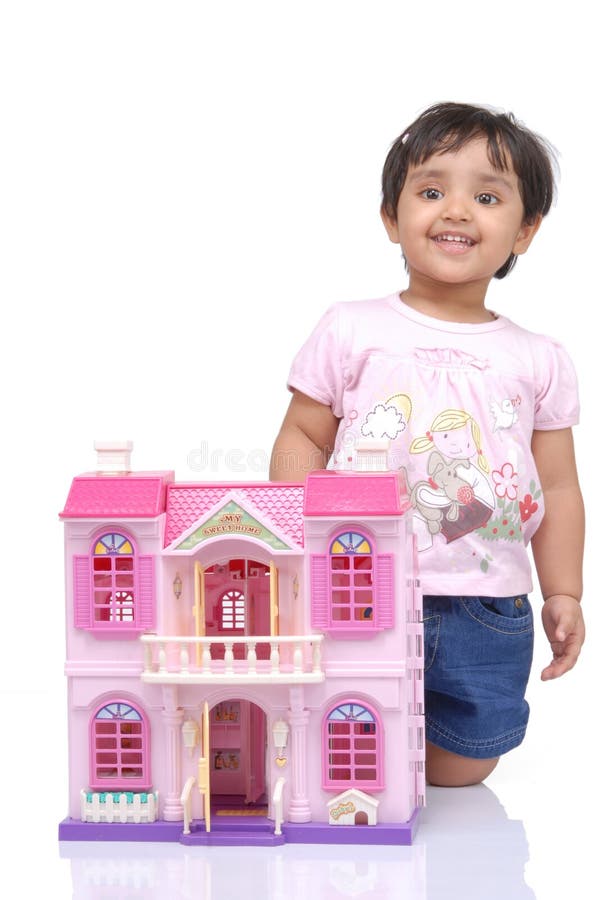 2-3 years old baby girl with doll house over white background. 2-3 years old baby girl with doll house over white background