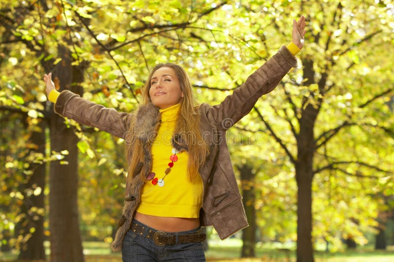 20-25 years old beautiful woman portrait in natural autumn outdoors. 20-25 years old beautiful woman portrait in natural autumn outdoors