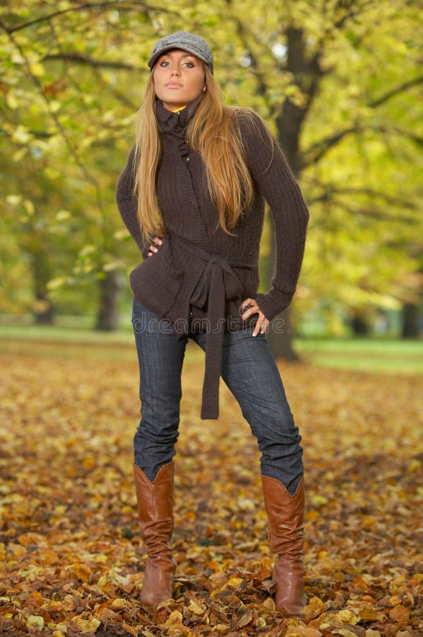 20-25 years old beautiful woman portrait in natural autumn outdoors. 20-25 years old beautiful woman portrait in natural autumn outdoors