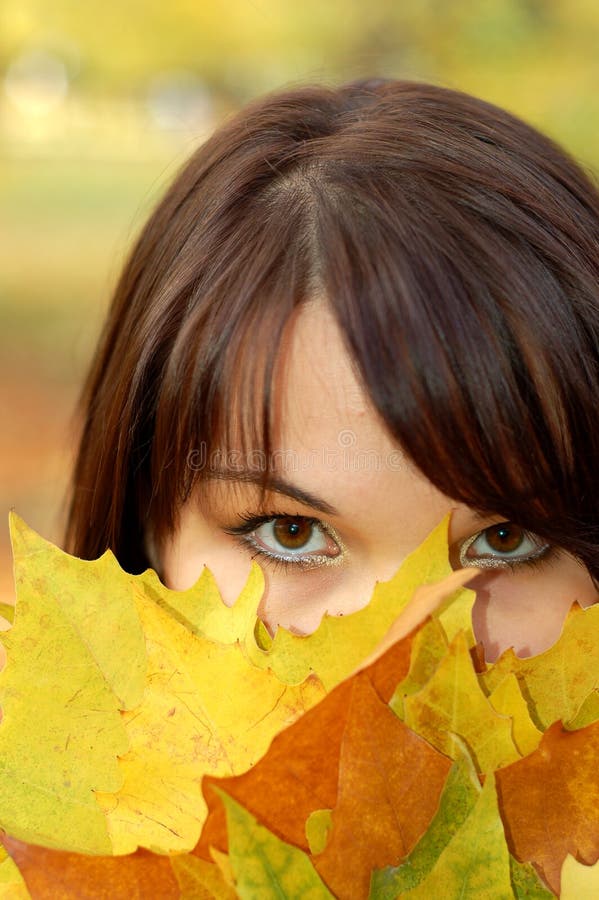 Attractive woman with colourful leaves. Attractive woman with colourful leaves