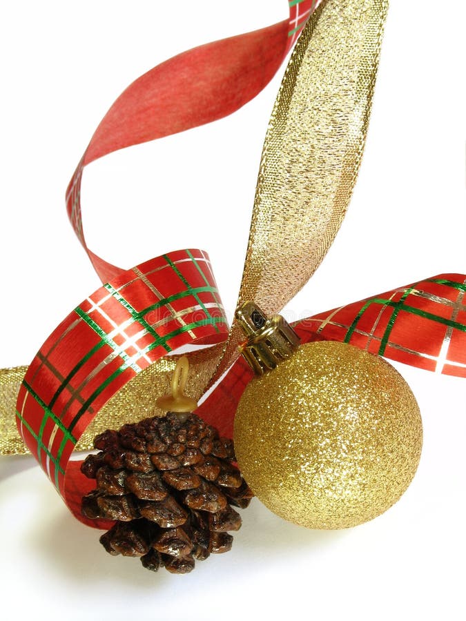 Christmas ornaments: gold ribbon, red ribbon, gold ball and pine cone on white background. Christmas ornaments: gold ribbon, red ribbon, gold ball and pine cone on white background