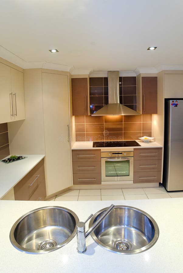 Kitchen well designed in cream white and brown found in your more recently built homes of today. Kitchen well designed in cream white and brown found in your more recently built homes of today