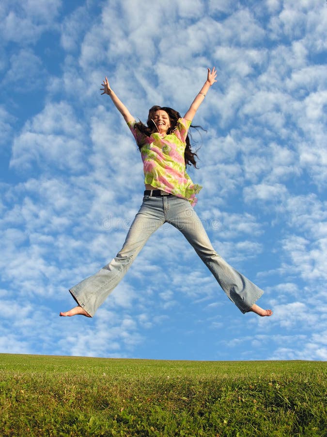 Jump girl with hair under real cloudfield. Jump girl with hair under real cloudfield