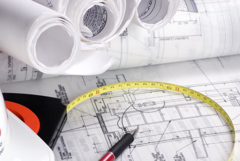 An engineer's work table with drawings and tools of the trade. An engineer's work table with drawings and tools of the trade