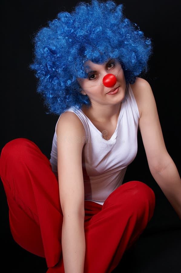 Nice girl with blue clown hair and red nose. Nice girl with blue clown hair and red nose