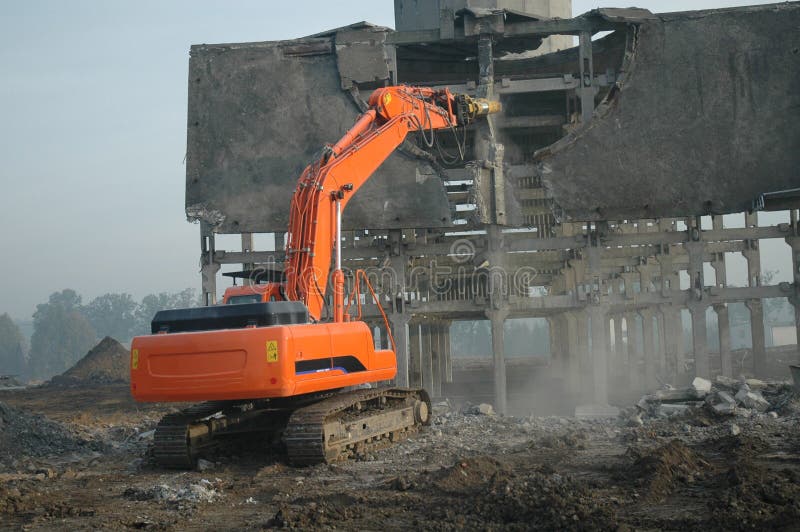 Dismantling ruin by digger #2, orange machine. Dismantling ruin by digger #2, orange machine