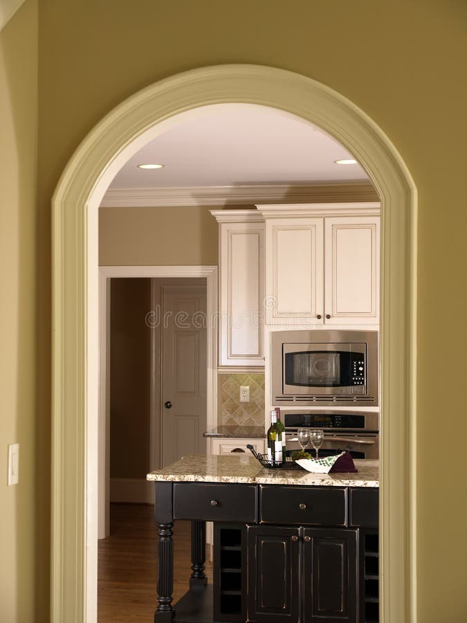 Luxury Model Home Kitchen through Arch door. Luxury Model Home Kitchen through Arch door