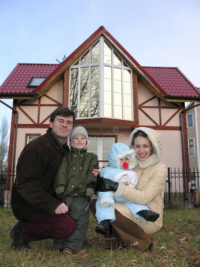 Family of four and home. closeup. 2. Family of four and home. closeup. 2