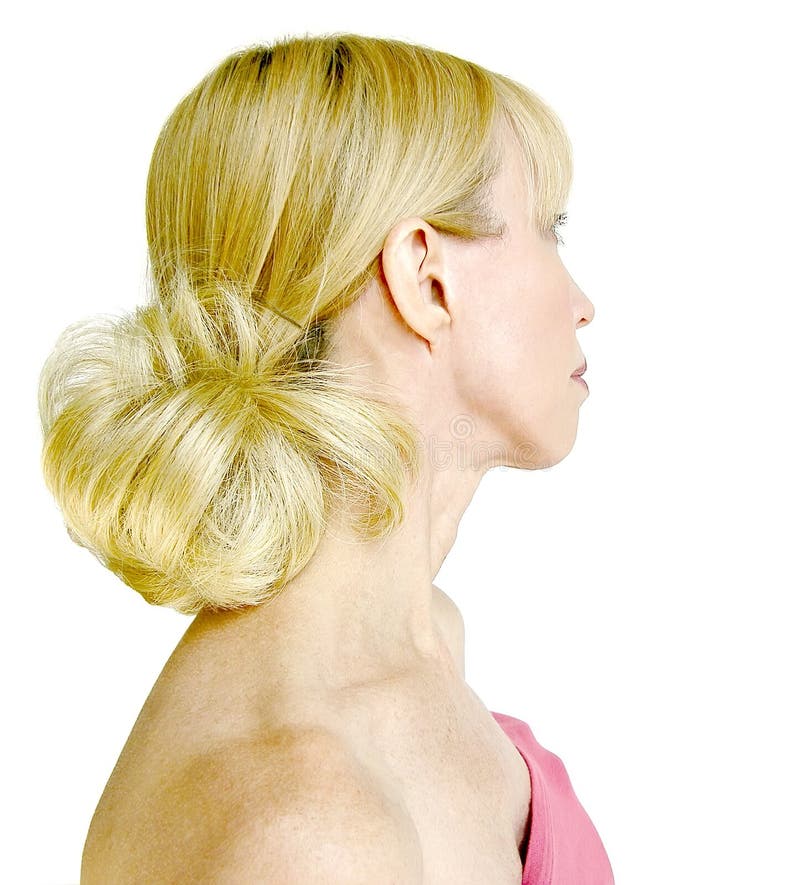 Portrait of a blonde haired woman, photographed somewhat in profile, with her hair perfectly coiffed, ready for her wedding or an evening out. Portrait of a blonde haired woman, photographed somewhat in profile, with her hair perfectly coiffed, ready for her wedding or an evening out.