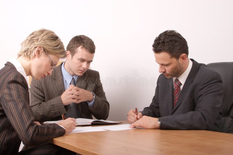 Business meeting - 2 men, 1 woman, - signing contract. Business meeting - 2 men, 1 woman, - signing contract