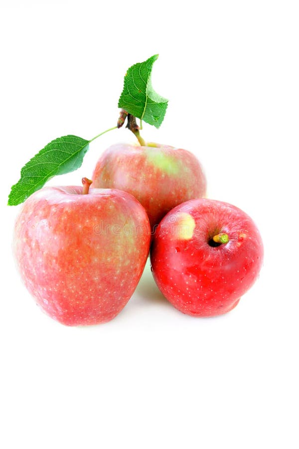 Three apples and one with leaves isolated on a white background. Three apples and one with leaves isolated on a white background.