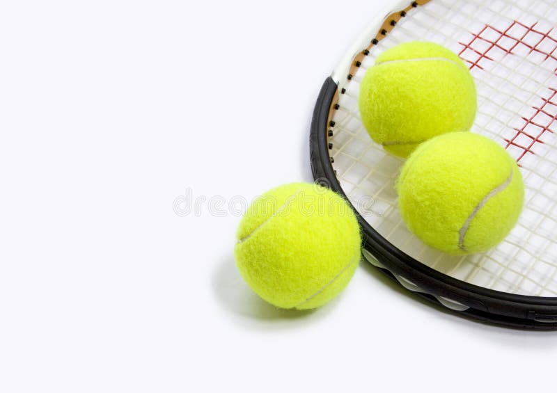 3 yellow tennis balls and a tennis racket on a white background. 3 yellow tennis balls and a tennis racket on a white background