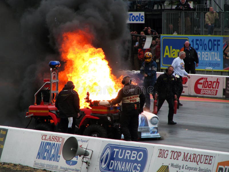 Santa Pod raceway, UK. FIA European Drag Racing Championship may 2011. During race burned one of the car. The Driver safely left the car. Santa Pod raceway, UK. FIA European Drag Racing Championship may 2011. During race burned one of the car. The Driver safely left the car.