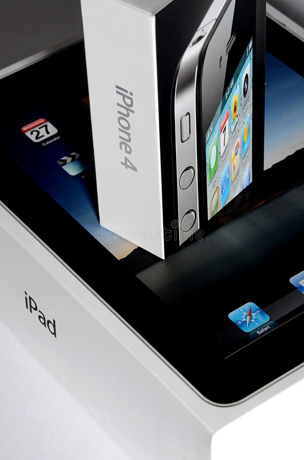 Apple Ipad and Iphone 4 Boxes on top of each other. Apple Ipad and Iphone 4 Boxes on top of each other
