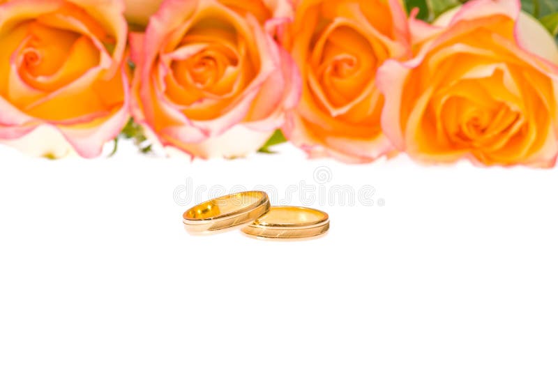 4 Red yellow roses and golden wedding ring over white. 4 Red yellow roses and golden wedding ring over white